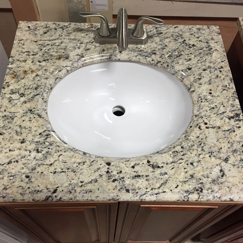 Santa Cecilia Light Granite vanity top with cabinet